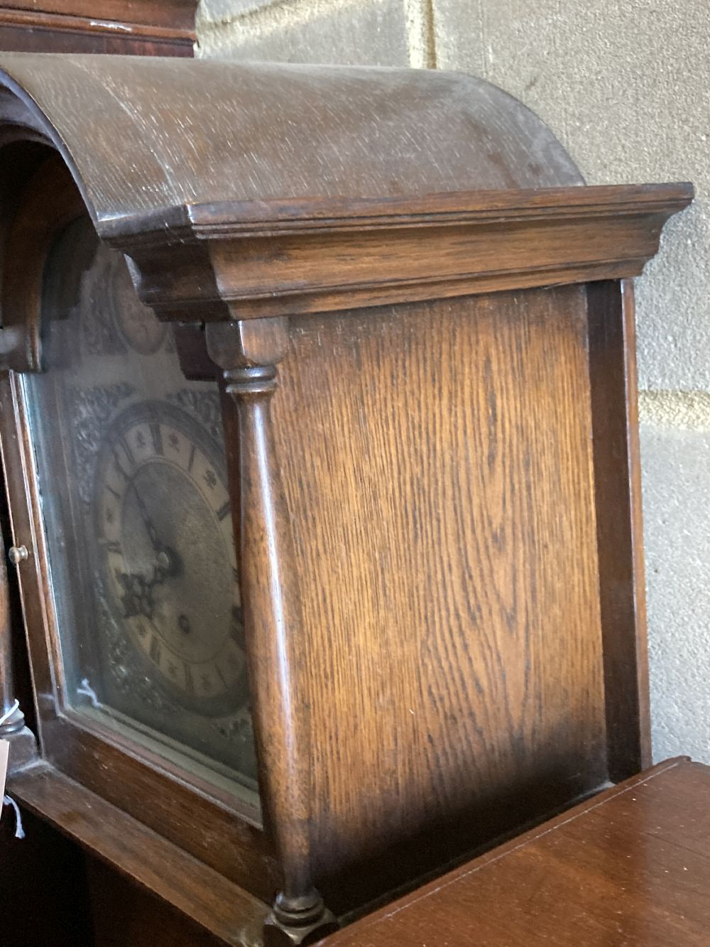 A 1930s/40s oak grandmother clock having Whittington/Westminster chimes, height 176cm